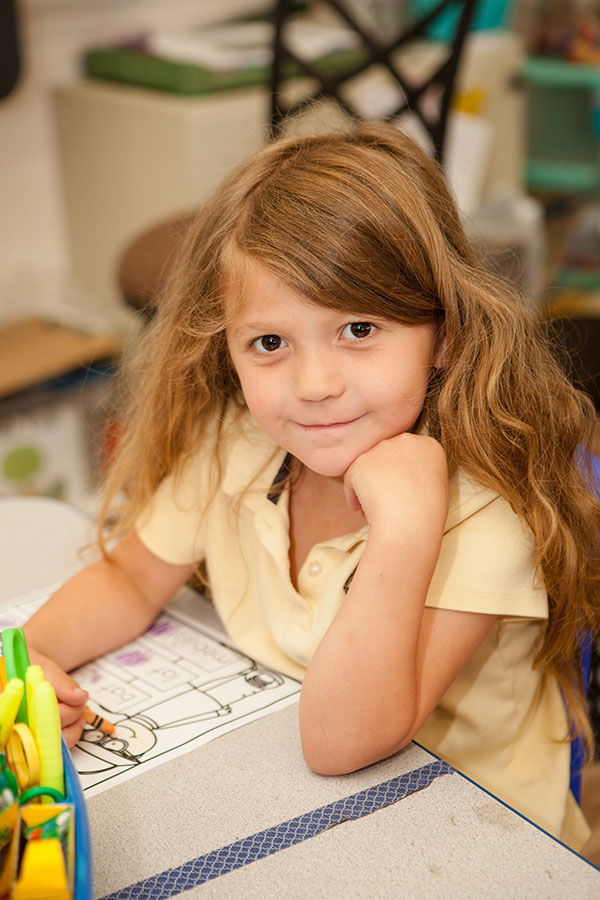 a child at a desk at The Charles Finney School